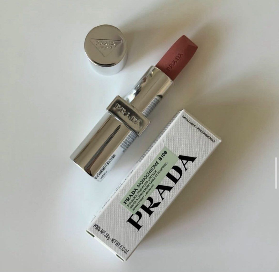 Prada Monochrome Lipstick (Category: Makeup) located in San Pedro. Submitted by hausoflux (Listing ID 1398446125, Image 1). Description: - Prada Monochrome Lipstick available shade: B01, B02, B03, B05, B15, B101, B102, B103, 077, U000 - Elegant silver case with Prada logo - Includes original box - Refillable and rechargeable design - Net weight: 3.5g / 0.13 oz Authentic!! available in minis and full size.