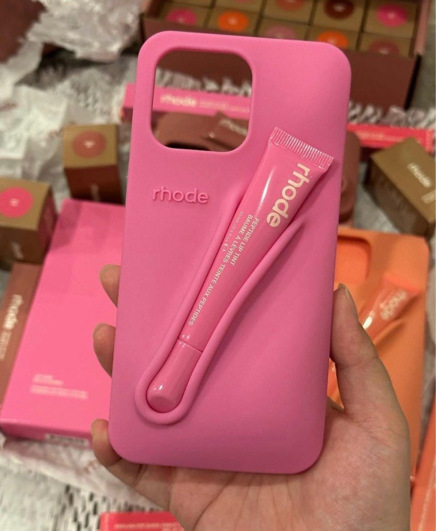 Rhode Iphone Case (Category: Cases & Sleeves) located in San Pedro. Submitted by hausoflux (Listing ID 1398445287, Image 3). Description: - Rhode iPhone Case - Available in colors (pink, orange, red, brown) - Features a built-in holder for Rhode Peptide Lip Tint - Stylish design - Protects your phone - Available in all iphone units 11 series up! authentic and brand new below SRP!!.
