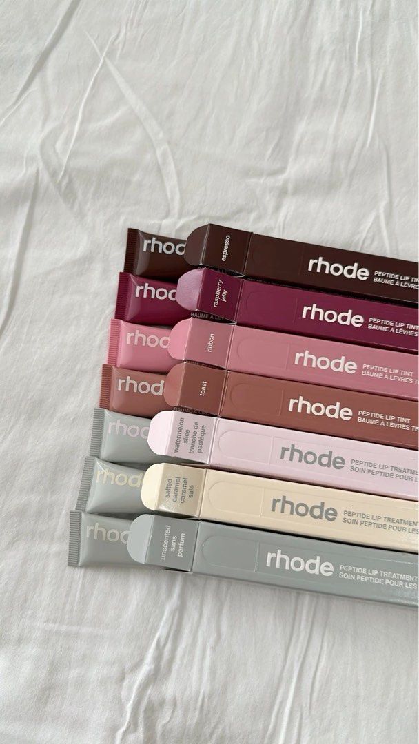 Rhode Peptide Lip Tint (Category: Makeup) located in San Pedro. Submitted by hausoflux (Listing ID 1398444515, Image 1). Description: - Rhode Peptide Lip Tints - Available Shades: Sugar Cookie, Toast, Raspberry Jelly, Ribbon, Espresso, Salty Tan, Peachy Pit, Shortcake, Guava Spritz, Cinnamon Roll, Strawberry, Jelly Bean, Peppermint Glaze, Unscented, Rhode Vanilla, Salted Caramel, Watermelon, Passion Fruit, Lemontini - Size: 10ml / 0.3 fl oz - Con