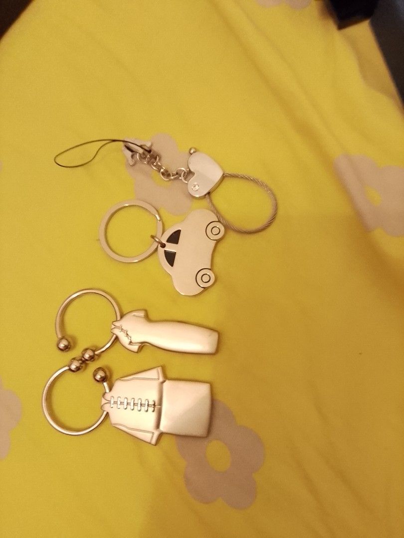 Silver Keychains (Category: Key & Remote) located in Singapore. Submitted by luciansstuff (Listing ID 1398474335, Image 1). Description: Set of 4 silver keychains: car, heart, and traditional clothing designs. Price is for the whole set, negotiable within reason.