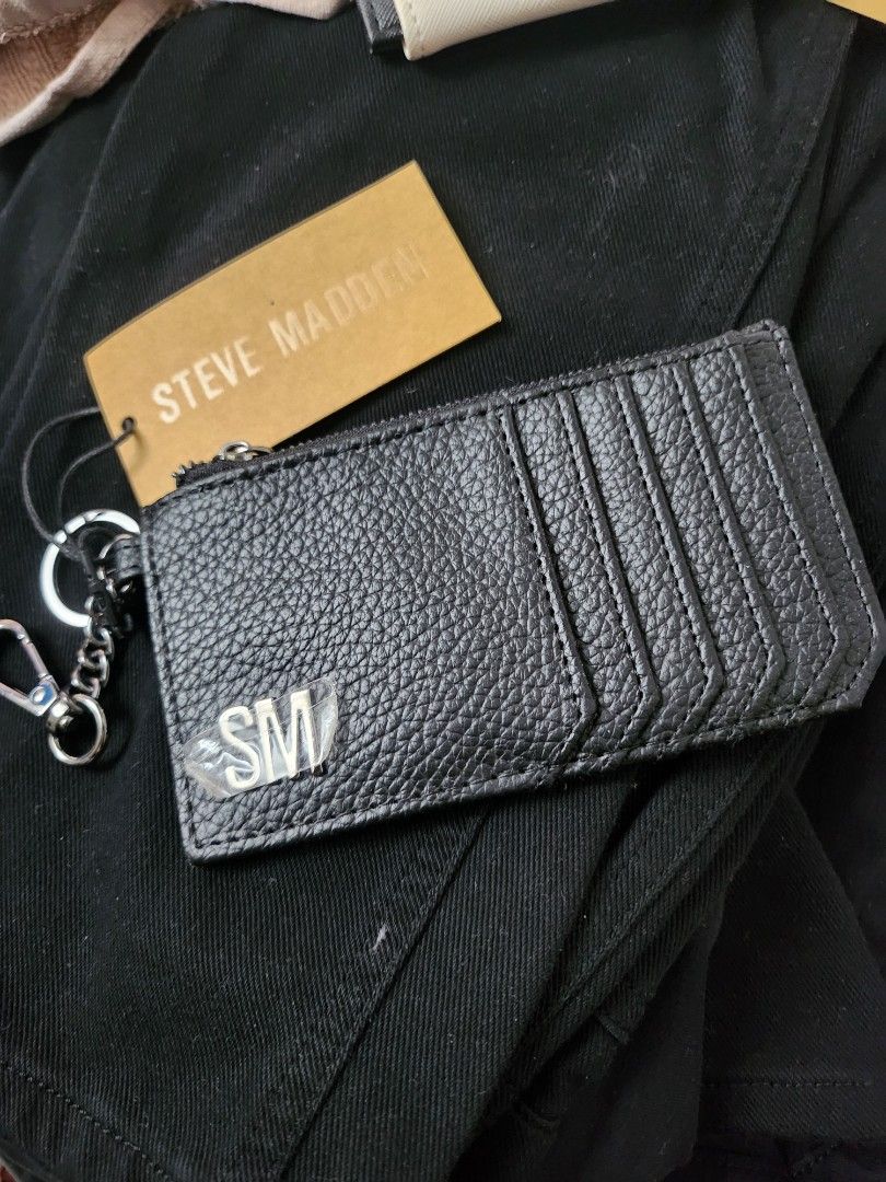Steve Madden Cardholder with Zipper (Category: Wallets & Card holders) located in Paranaque City. Submitted by issadlr (Listing ID 1398412905, Image 1). Description: - Black Steve Madden cardholder - Zipper closure - Multiple card slots - Key ring - Steve Madden logo - Includes original tag - Model number and retail price on tag.