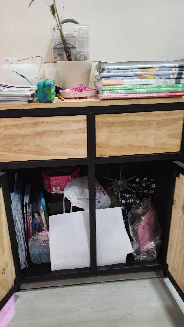 Wooden Storage Cabinet with Black Frame (Category: Shelves, Cabinets & Racks) located in Quezon City. Submitted by ishopph (Listing ID 1398351766, Image 3). Description: - Wooden storage cabinet real pine wood - Black frame - Two doors - Multiple compartments for storage - Sturdy construction - Ideal for home or office use - Provides ample storage space Condition: 8/10 Issue: slightly rough finish RFS: Upgrading FOR PICK UP ONLY! pm for other dee