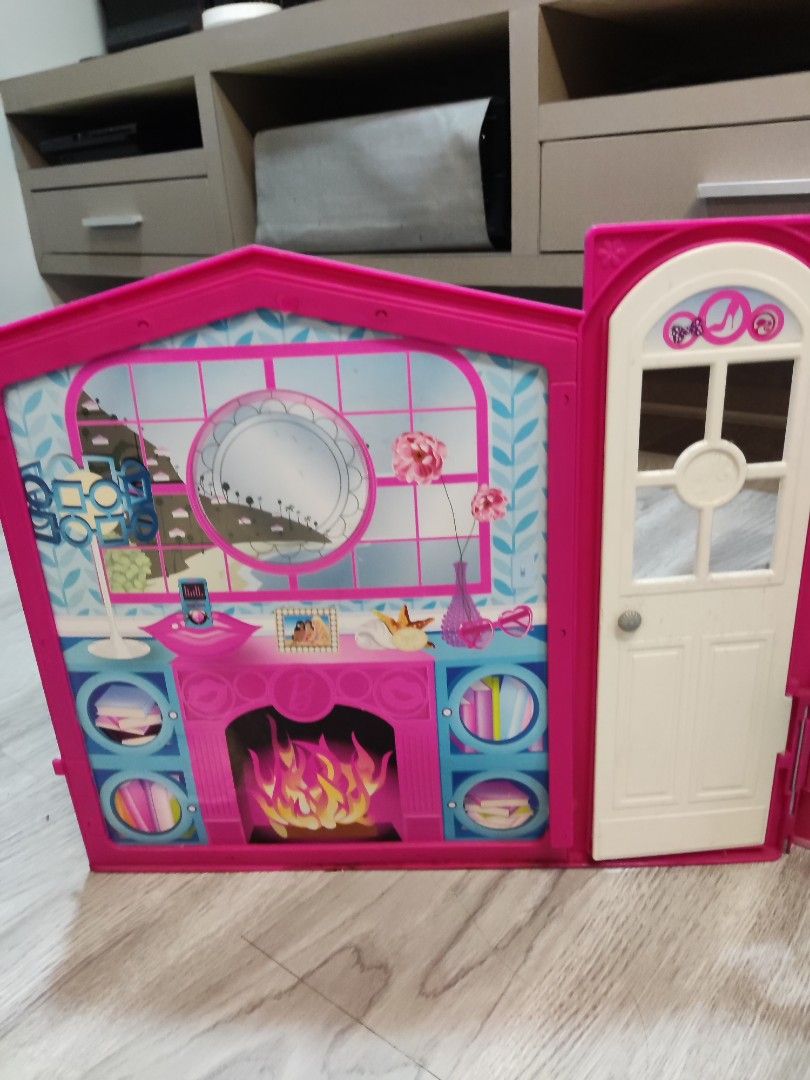 Barbie Dreamhouse Playset (Category: Kids Toys) located in Quezon City. Submitted by torricograces (Listing ID 1398563397, Image 3). Description: - Barbie Dreamhouse playset - Includes kitchen, living room, bathroom, and outdoor patio - Features a pink and white color scheme - Comes with various accessories .