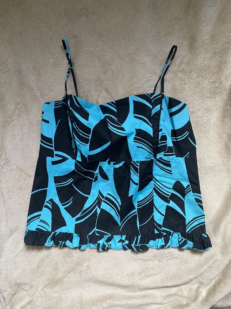 Blue and Black Patterned Cami Top (Category: Sleeveless) located in Rizal. Submitted by declutterwsky (Listing ID 1398599538, Image 1). Description: Patterned cami top tied at the back - fits extra small to small - just tried it on - dm for a ww pic price is negotiable ^___^ rfs: dont fit .