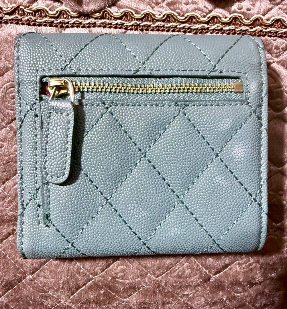 Chanel Quilted Trifold Wallet (Category: Luxury Bags & Wallets) located in Cavite. Submitted by lady_speculator_ph (Listing ID 1398698949, Image 2). Description: ✨ Quilted design with flap closure ✨ Iconic gold-tone CC logo ✨ Multiple card slots for organization ✨ Includes a zippered compartment ✨ Elegant light blue interior ✨ Serial number visible Note: Authenticity is not guaranteed There are minimal signs of use. Please manage your expectation