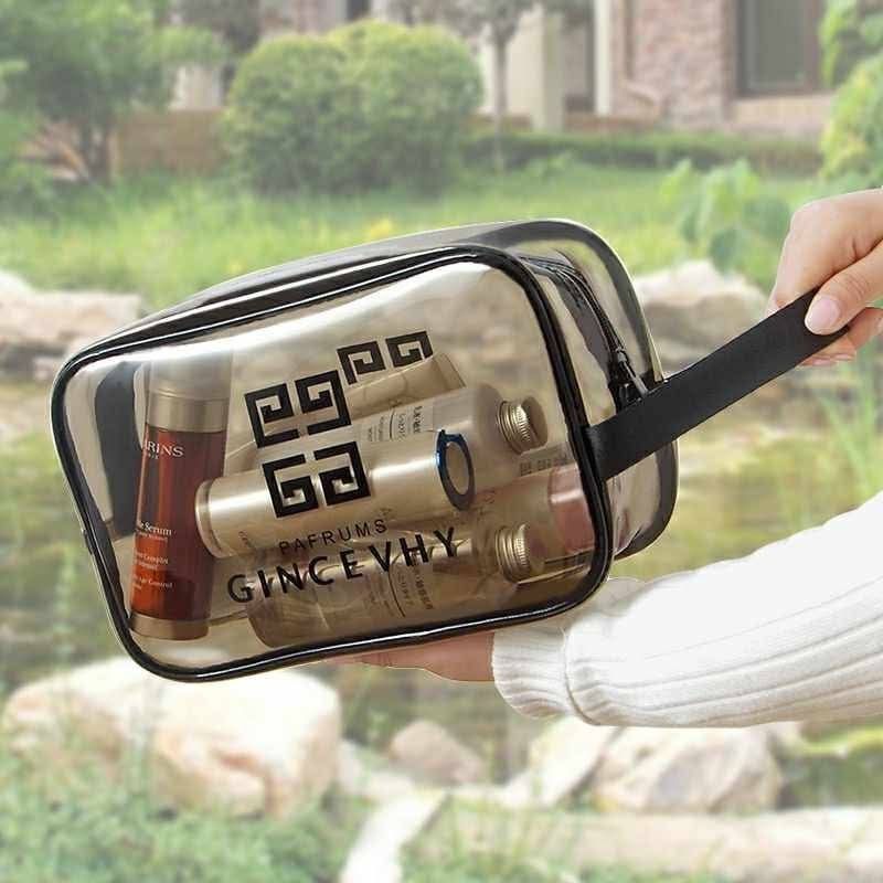Clear Cosmetic Bag Set 3in1 (Category: Makeup) located in Manila. Submitted by lyfrancois14 (Listing ID 1398615158, Image 2). Description: Set of three clear cosmetic bags from Gincevhy. The bags come in different sizes, with a large tote bag and two smaller pouches. They feature black handles and a black Gincevhy logo. The bags are transparent, allowing you to easily see the contents inside. Perfect for organizing your cosmetics or toiletries..