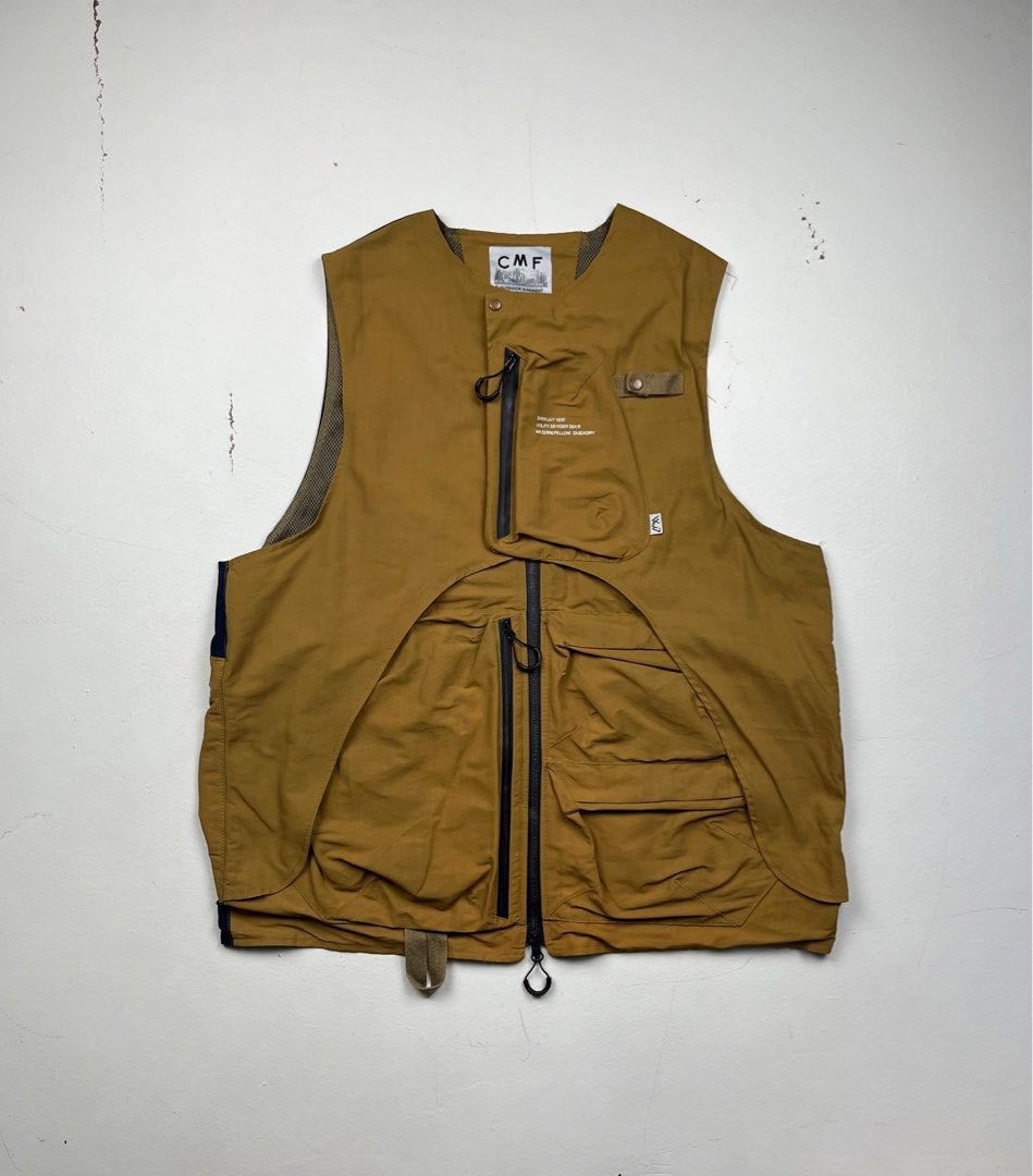 Comfy Outdoor Garment Overlay Vest (Category: Vests) located in Quezon City. Submitted by forgarments (Listing ID 1398621783, Image 2). Description: Comfy Outdoor Garment Overlay Vest Excellent Condition Size: XL Chest width: 23.5 Inches Length: 28 Inches Comfy Outdoor Garment revisits its coveted limited edition collaboration with eye_C Magazine through this refined brown iteration of the Overlay Vest. Crafted from durable, water-repellent nylon