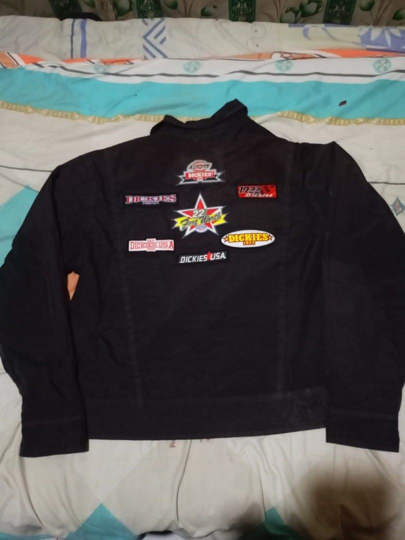 Dickies Racing Jacket (Category: Coats, Jackets and Outerwear) located in Santo Tomas. Submitted by ven_thrift (Listing ID 1398597271, Image 2). Description: - Black Dickies jacket - Collared neckline - Buttoned cuffs - Zipper closure - Front patches: "GTT", "www.dickies.com" - Back patches: "Dickies USA".