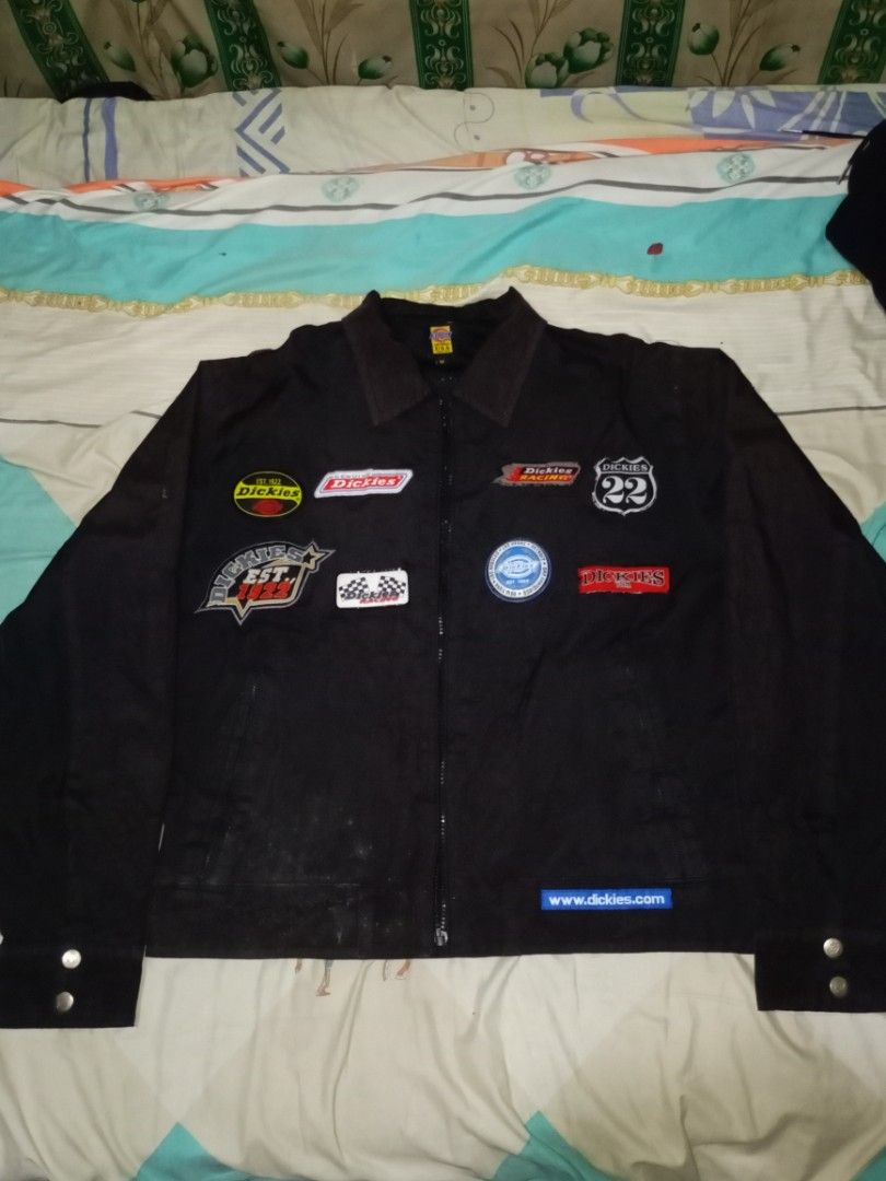 Dickies Racing Jacket (Category: Coats, Jackets and Outerwear) located in Santo Tomas. Submitted by ven_thrift (Listing ID 1398597271, Image 1). Description: - Black Dickies jacket - Collared neckline - Buttoned cuffs - Zipper closure - Front patches: "GTT", "www.dickies.com" - Back patches: "Dickies USA".