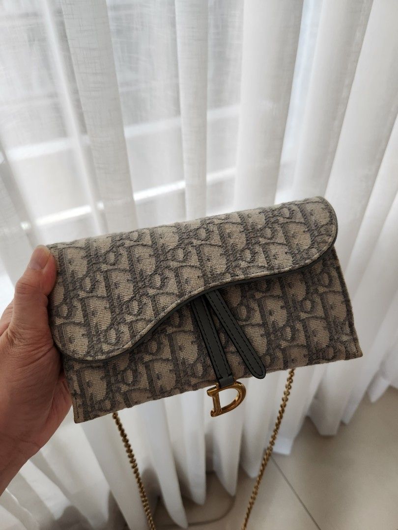 Dior saddle pouch with chain almost brand new (Category: Luxury Bags & Wallets) located in San Juan City. Submitted by dailydealsphest2010 (Listing ID 1398554923, Image 1). Description: almost brand new condition 💯💯💯 authentic Key features that support this identification are: ​The distinctive asymmetrical flap design, which is the signature shape of the Dior Saddle line. ​The use of the iconic Dior Oblique jacquard canvas (monogram pattern). 