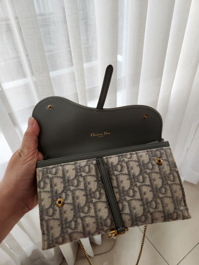Dior saddle pouch with chain almost brand new (Category: Luxury Bags & Wallets) located in San Juan City. Submitted by dailydealsphest2010 (Listing ID 1398554923, Image 2). Description: almost brand new condition 💯💯💯 authentic Key features that support this identification are: ​The distinctive asymmetrical flap design, which is the signature shape of the Dior Saddle line. ​The use of the iconic Dior Oblique jacquard canvas (monogram pattern). 