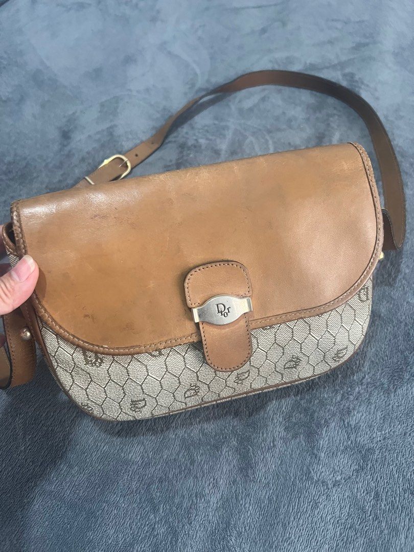 Dior Shoulder Bag (Category: Luxury Bags & Wallets) located in Quezon City. Submitted by kayesantos7 (Listing ID 1398543837, Image 2). Description: Super Sale!!! - Vintage Dior shoulder bag - Tan leather flap and strap - Dior logo clasp - Repeating Dior pattern on body - Matching fabric interior - Adjustable shoulder strap Selling my vintage Christian Dior honeycomb leather shoulder bag! Has signs of usage as seen on the photos. Still so timeless