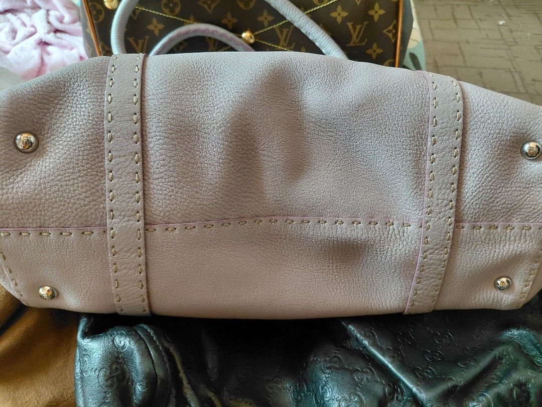 Authentic Fendi Leather Handbag (Category: Luxury Bags & Wallets) located in Pasig City. Submitted by redellie (Listing ID 1398596281, Image 3). Description: - Fendi handbag in a light purple color - Features a top handle design - Secure buckle closure - Interior includes a branded metal plate - Structured shape with visible stitching - Includes a small brand logo tag Linda Selleria (large) no inclusions. open for layaway (terms: 3months no addit