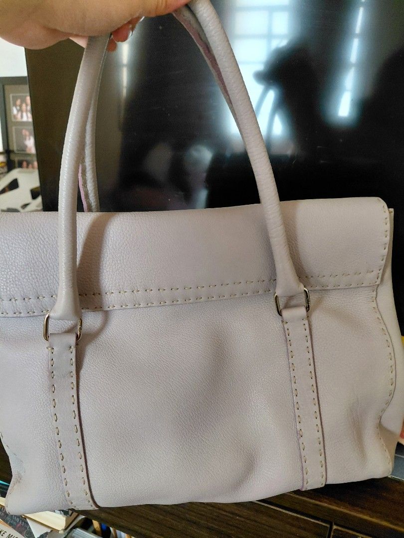 Authentic Fendi Leather Handbag (Category: Luxury Bags & Wallets) located in Pasig City. Submitted by redellie (Listing ID 1398596281, Image 2). Description: - Fendi handbag in a light purple color - Features a top handle design - Secure buckle closure - Interior includes a branded metal plate - Structured shape with visible stitching - Includes a small brand logo tag Linda Selleria (large) no inclusions. open for layaway (terms: 3months no addit