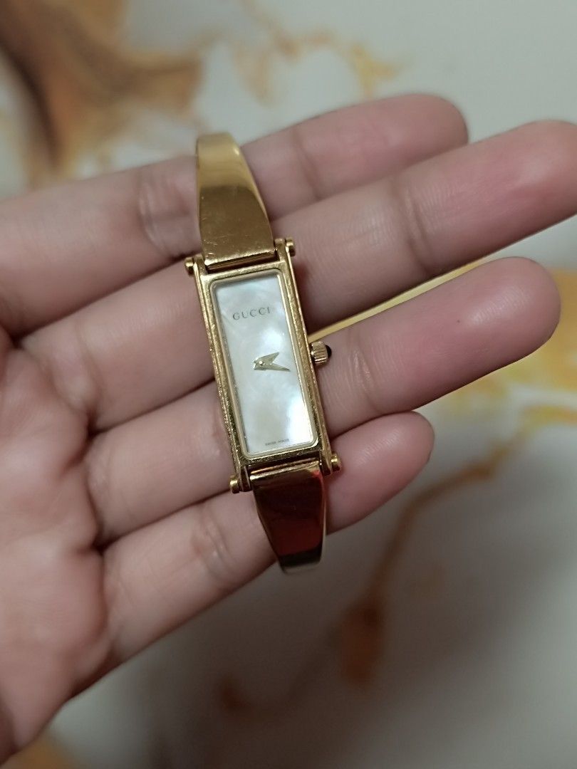 Gucci Bangle Watches (Category: Luxury Watches) located in Quezon City. Submitted by maeclosetph (Listing ID 1397945780, Image 3). Description: - Gucci Bangle Watch Collection: - Watch 1: Rectangular dark face, silver band, burgundy leather strap. - Watch 2: Square dark face, silver band. - Watch 3: Rectangular white face, gold band. Gucci gold-12k Gucci silver-10k Gucci square-8,500.