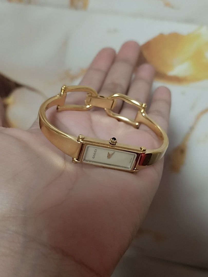 Gucci Bangle Watches (Category: Luxury Watches) located in Quezon City. Submitted by maeclosetph (Listing ID 1397945780, Image 2). Description: - Gucci Bangle Watch Collection: - Watch 1: Rectangular dark face, silver band, burgundy leather strap. - Watch 2: Square dark face, silver band. - Watch 3: Rectangular white face, gold band. Gucci gold-12k Gucci silver-10k Gucci square-8,500.