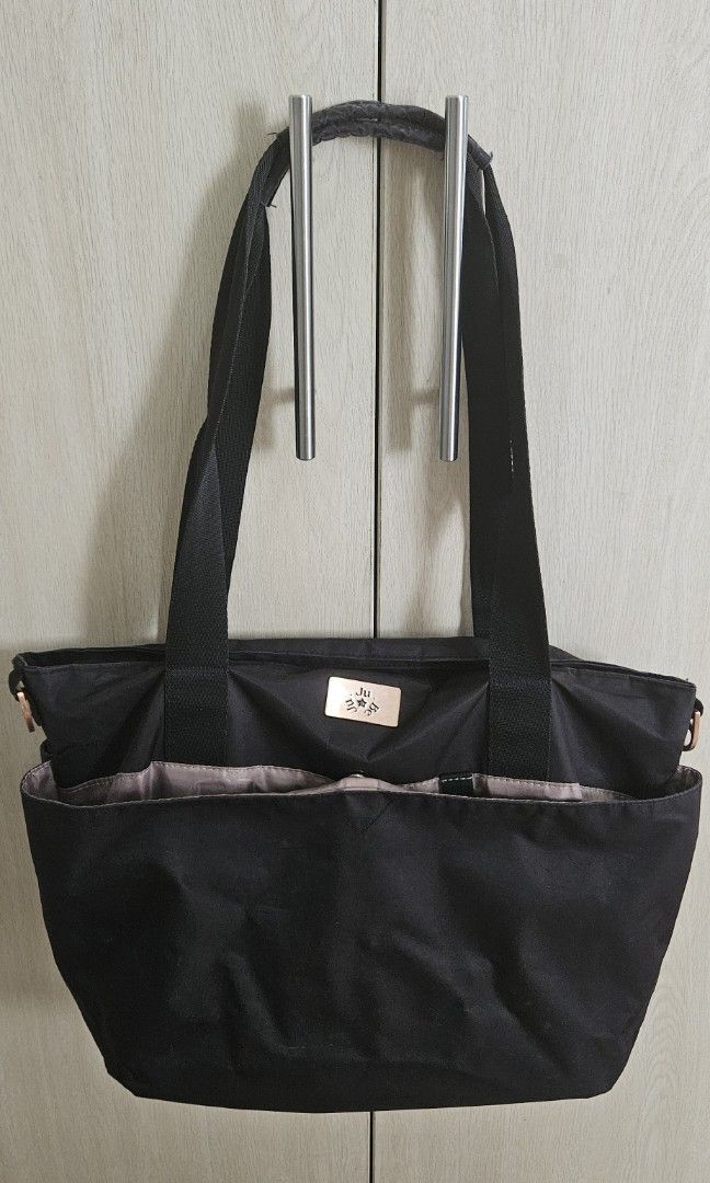 Jujube black encore diaper tote nylon (Category: Shoulder Bags) located in Manila. Submitted by preloved.christine (Listing ID 1398578324, Image 1). Description: with stroller hooks, no more diaper pad super light weight, has a lot of compartments, shoulder strap is also long enough for comfortable carrying.