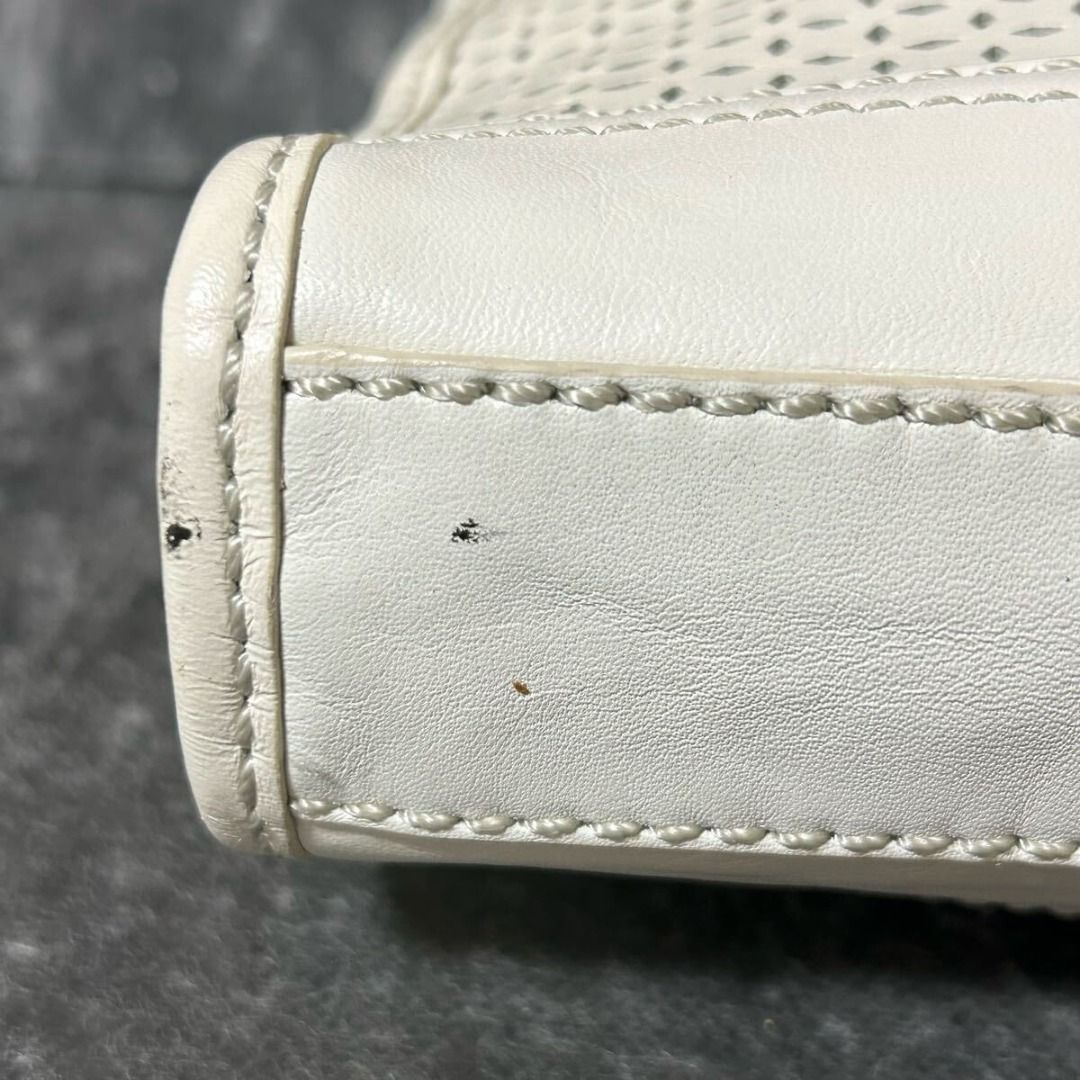 Leather ColeHaan Handbag Perforated White (Category: Shoulder Bags) located in Paranaque City. Submitted by iveskixs (Listing ID 1398603593, Image 2). Description: Cole Haan Leather Handbag Perforated White Authenticity Guaranteed Purchased in Japan [Size] Width 28cm, Height 19cm, Depth 6cm, Handle Height 20cm - There is a slight stain on the bottom of the bag, but no noticeable damage and it is in relatively good condition - Colors may appear di