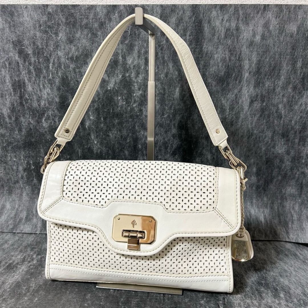Leather ColeHaan Handbag Perforated White (Category: Shoulder Bags) located in Paranaque City. Submitted by iveskixs (Listing ID 1398603593, Image 1). Description: Cole Haan Leather Handbag Perforated White Authenticity Guaranteed Purchased in Japan [Size] Width 28cm, Height 19cm, Depth 6cm, Handle Height 20cm - There is a slight stain on the bottom of the bag, but no noticeable damage and it is in relatively good condition - Colors may appear di