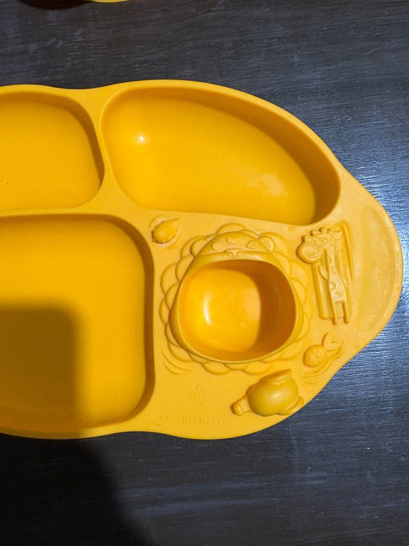 Marcus & Marcus Baby Feeding Set with Hoshi Silicon Cup (Category: Weaning & Toddler Feeding) located in Tagaytay City. Submitted by bullet__ (Listing ID 1398696041, Image 3). Description: - Marcus & Marcus baby feeding set - Includes a divided plate with animal designs - Plate has sections for different food types - Includes a separate bowl with handles - Made of yellow material - Easy grip bowl With Hoshi silicon cup.