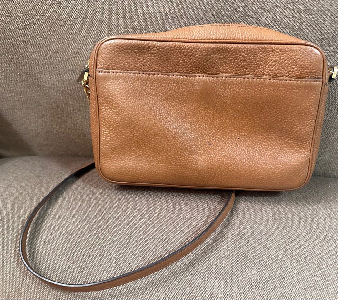 MK sling bag (Category: Cross-body Bags) located in Pasig City. Submitted by chubby_cheeks (Listing ID 1398555908, Image 3). Description: With few light stains, check photos .