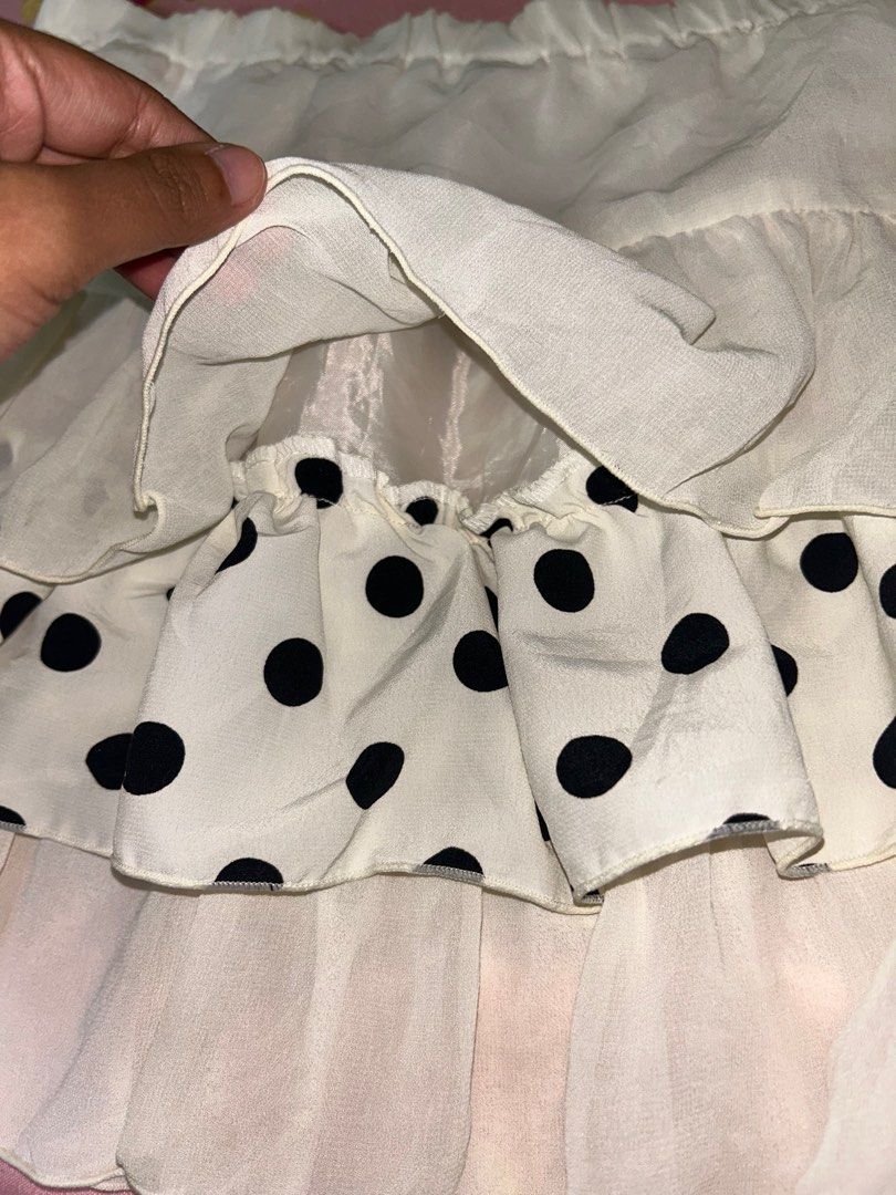 Polka Dot Ruffle Skirt (Category: Skirts) located in Davao. Submitted by declutterstuff01 (Listing ID 1398693059, Image 2). Description: - Unique design with alternating solid and polka dot fabric - Ruffled hem - Elastic waistband - Light color (off-white/cream) - Lightweight material - Versatile for various outfits.