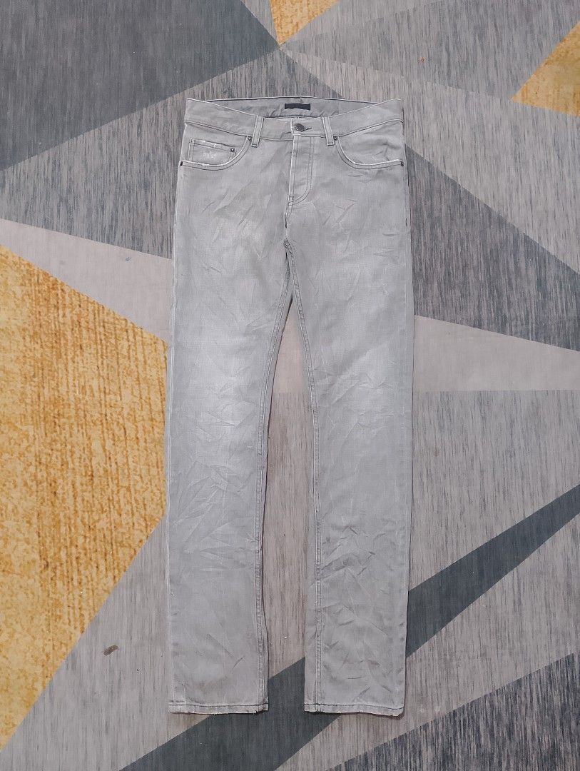 Prada Tight Fit Jeans (Category: Luxury Apparel) located in Santiago. Submitted by dc_daily_thrift (Listing ID 1398699432, Image 1). Description: - Prada Tight Fit jeans - Color: Grey - Size: 29 on tag 32 on measuring tape - Features: Button closure with Prada logo, classic five-pocket design, straight leg fit - Details: Prada logo on back leather patch and inside tag - Made in Romania.