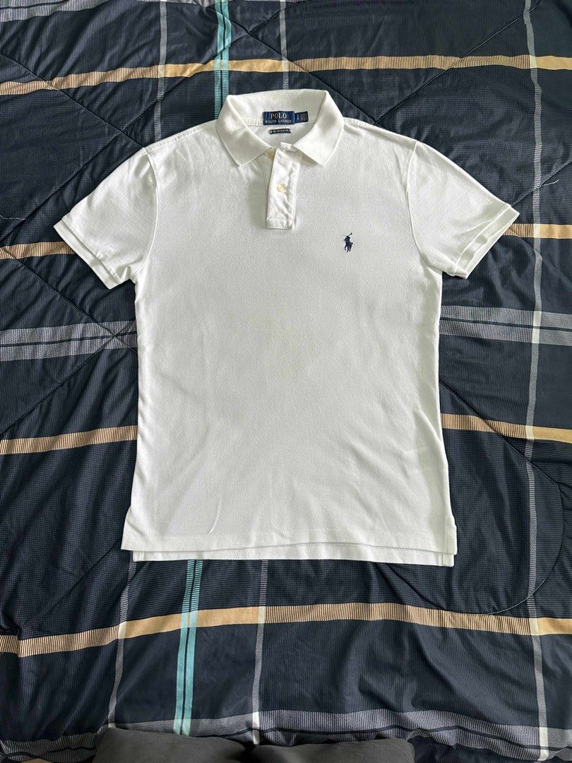 Ralph Lauren polo shirt (Category: Tshirts & Polo Shirts ) located in San Juan City. Submitted by drewselects (Listing ID 1398641046, Image 1). Description: RL white polo shirt (legit) Small fits medium-large Issue: none (good as bnew) L: 65cm W: 45cm 2k.