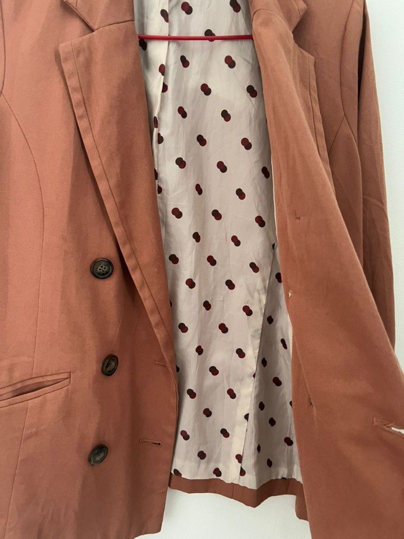 Rust Orange Bundle (Category: Coats, Jackets and Outerwear) located in Shah Alam. Submitted by thriftbundle (Listing ID 1398527863, Image 2). Description: Size = M suitable for 50kg below Rust orange double-breasted blazer. Classic design with notched lapel, button details, and functional pockets. Polka dot lining. Versatile for any occasion..