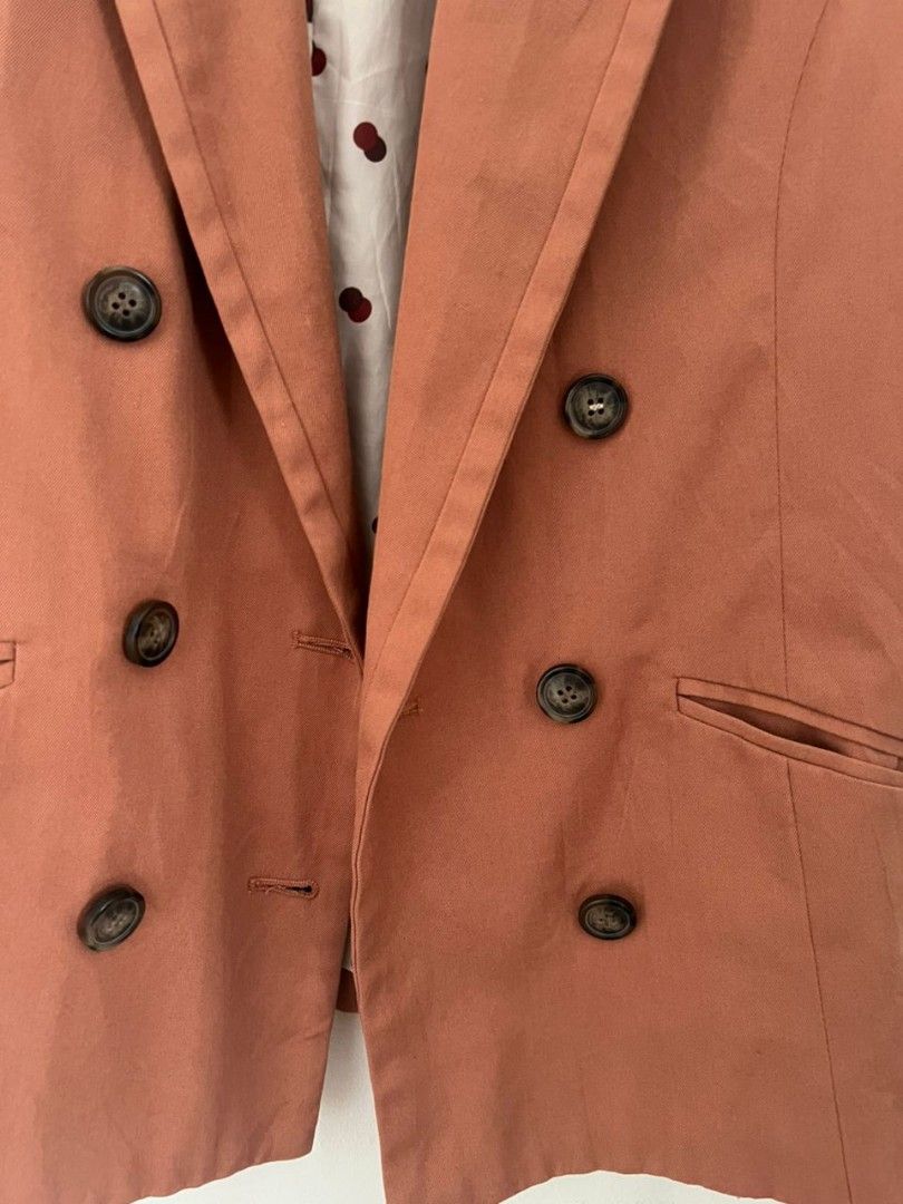 Rust Orange Bundle (Category: Coats, Jackets and Outerwear) located in Shah Alam. Submitted by thriftbundle (Listing ID 1398527863, Image 3). Description: Size = M suitable for 50kg below Rust orange double-breasted blazer. Classic design with notched lapel, button details, and functional pockets. Polka dot lining. Versatile for any occasion..