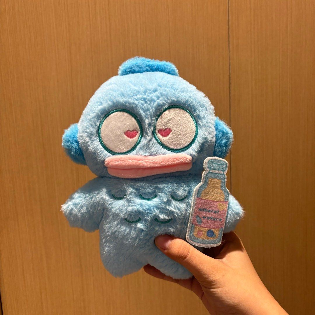 TIMEZONE Hangyodon Plush Toy with Drink Patch (Category: Plushies & Soft Toys) located in Manila. Submitted by kfgin (Listing ID 1398634879, Image 1). Description: - Adorable Hangyodon plush toy - Features heart-shaped eyes and pink beak - Includes a small drink bottle patch - Soft and cuddly material - Perfect for collectors or gifts - Charming addition to any collection.