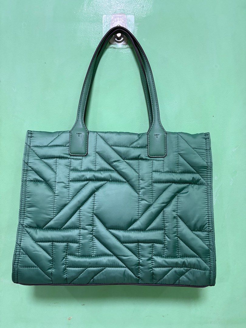 Tory Burch Small Ella Tote (Category: Luxury Bags & Wallets) located in Manila. Submitted by smgllrdo76459 (Listing ID 1398589303, Image 2). Description: Height: 10.4” (26.5cm); length: 13.4” (34cm); depth: 4.3” (11cm) Fits a laptop up to 13” Polyester; faux leather trim Recycled polyester lining Brass hardware Bridge with hidden magnetic snap closure; snaps on gussets Top handles with 7.3” (18.5cm) drop 1 interior slit pocket, 1 interior zipper 