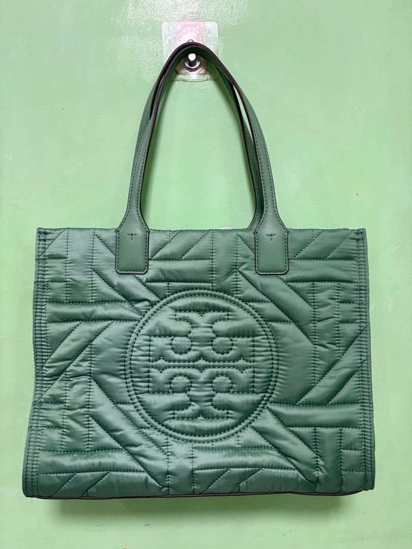 Tory Burch Small Ella Tote (Category: Luxury Bags & Wallets) located in Manila. Submitted by smgllrdo76459 (Listing ID 1398589303, Image 1). Description: Height: 10.4” (26.5cm); length: 13.4” (34cm); depth: 4.3” (11cm) Fits a laptop up to 13” Polyester; faux leather trim Recycled polyester lining Brass hardware Bridge with hidden magnetic snap closure; snaps on gussets Top handles with 7.3” (18.5cm) drop 1 interior slit pocket, 1 interior zipper 