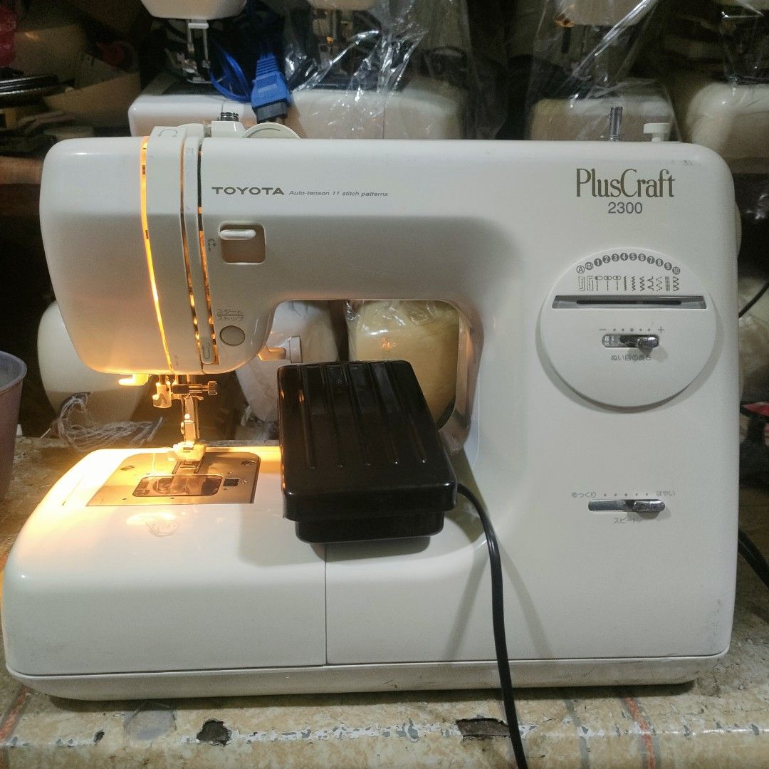 Toyota PlusCraft 2300 Sewing Machine (Category: Craft Supplies & Tools) located in Manila. Submitted by faststone-c3c8 (Listing ID 1398638258, Image 3). Description: - Toyota PlusCraft 2300 sewing machine - Variety of stitch patterns - Adjustable settings - Includes foot pedal - Built-in light - White body with control panel - Good working condition.
