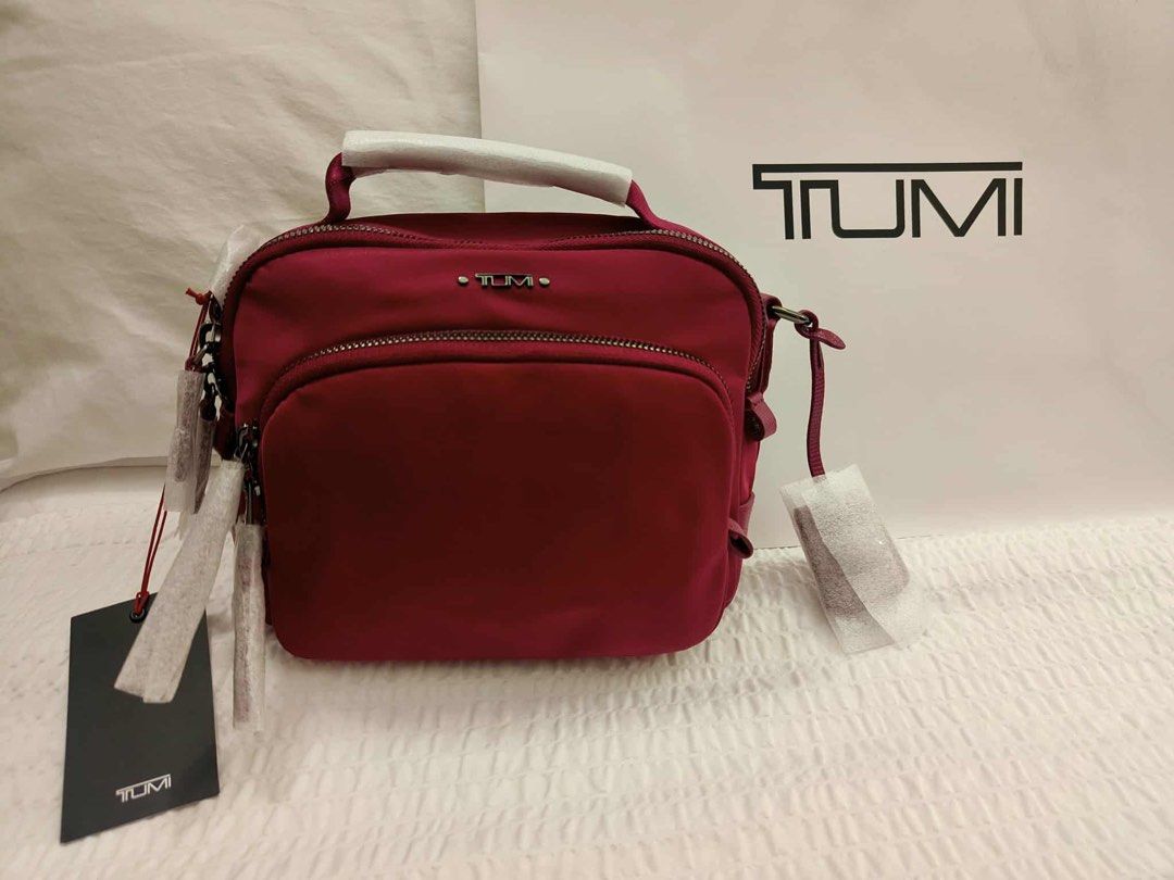 TUMI TAMY Crossbody (Category: Cross-body Bags) located in Manila. Submitted by mayeli (Listing ID 1398563353, Image 2). Description: Color: dark sherry Limited only Dimension 18H x 5.75D x 21W cm Weight 0.52 kg.