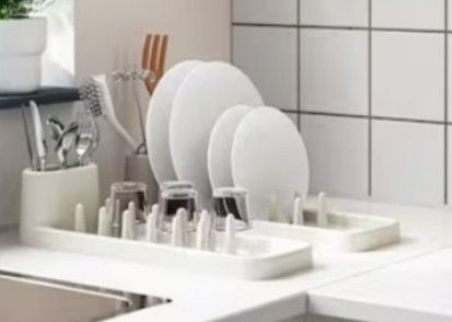 White Dish Drying Rack (Category: Other Kitchenware & Tableware) located in San Juan City. Submitted by maias.secret (Listing ID 1398669426, Image 3). Description: - White dish drying rack - Features pegs for plates and glasses - Rectangular design with raised edges - Durable material - Perfect for countertop use - Space-saving kitchen solution - Reason for Selling,not needed. -I bought this to IKEA but no space na pala. - Thanks and God bless yo