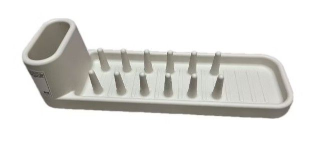 White Dish Drying Rack (Category: Other Kitchenware & Tableware) located in San Juan City. Submitted by maias.secret (Listing ID 1398669426, Image 1). Description: - White dish drying rack - Features pegs for plates and glasses - Rectangular design with raised edges - Durable material - Perfect for countertop use - Space-saving kitchen solution - Reason for Selling,not needed. -I bought this to IKEA but no space na pala. - Thanks and God bless yo