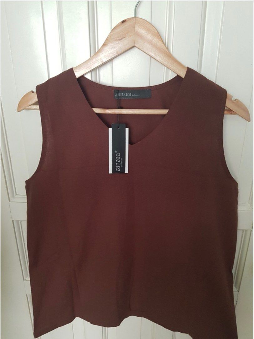 Zanzea Brown Sleeveless Linen Top (Category: Sleeveless) located in Antipolo. Submitted by p0123 (Listing ID 1398563260, Image 3). Description: -Brand new in size LARGE and color brown. Tag is still on -Linen Cotton -No issues. Good quality. Perfect for summer -MOP: gcash - Sf shouldered by buyer.