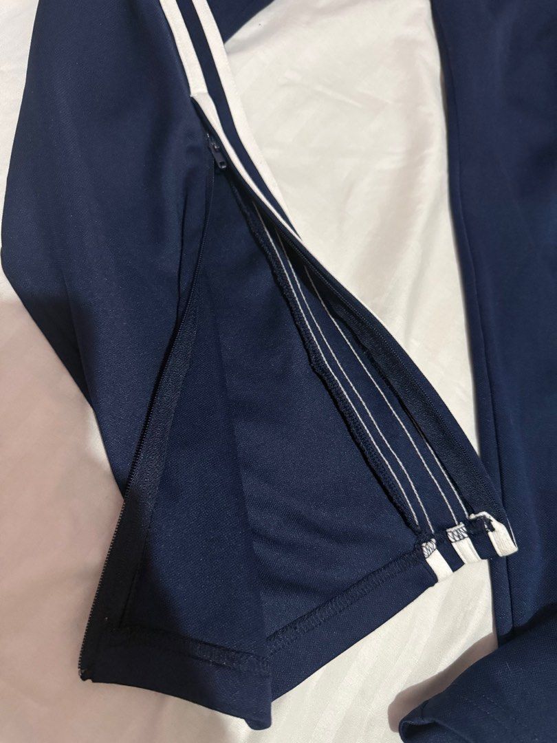 Adidas Track Pants 3 Lines (Category: Other Bottoms) located in Caloocan City. Submitted by jayneejeonsmiling (Listing ID 1398758251, Image 3). Description: Navy Blue Large Waist 28-34 inches Length 39” Polyester fabric.