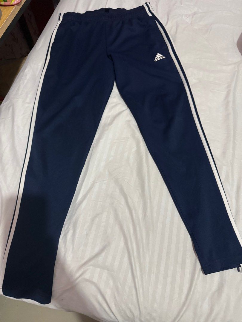 Adidas Track Pants 3 Lines (Category: Other Bottoms) located in Caloocan City. Submitted by jayneejeonsmiling (Listing ID 1398758251, Image 1). Description: Navy Blue Large Waist 28-34 inches Length 39” Polyester fabric.
