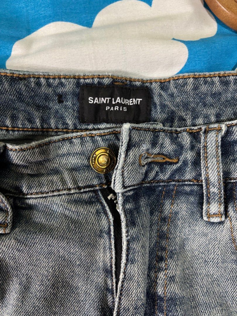 Authentic Saint Laurent Paris Jeans (Category: Luxury Apparel) located in Tayabas. Submitted by mandothriftss (Listing ID 1398729650, Image 3). Description: - Authentic Saint Laurent Paris jeans - Features YSL logo - Waist size: 30 - Made in Italy - Classic denim wash - Stylish and timeless.