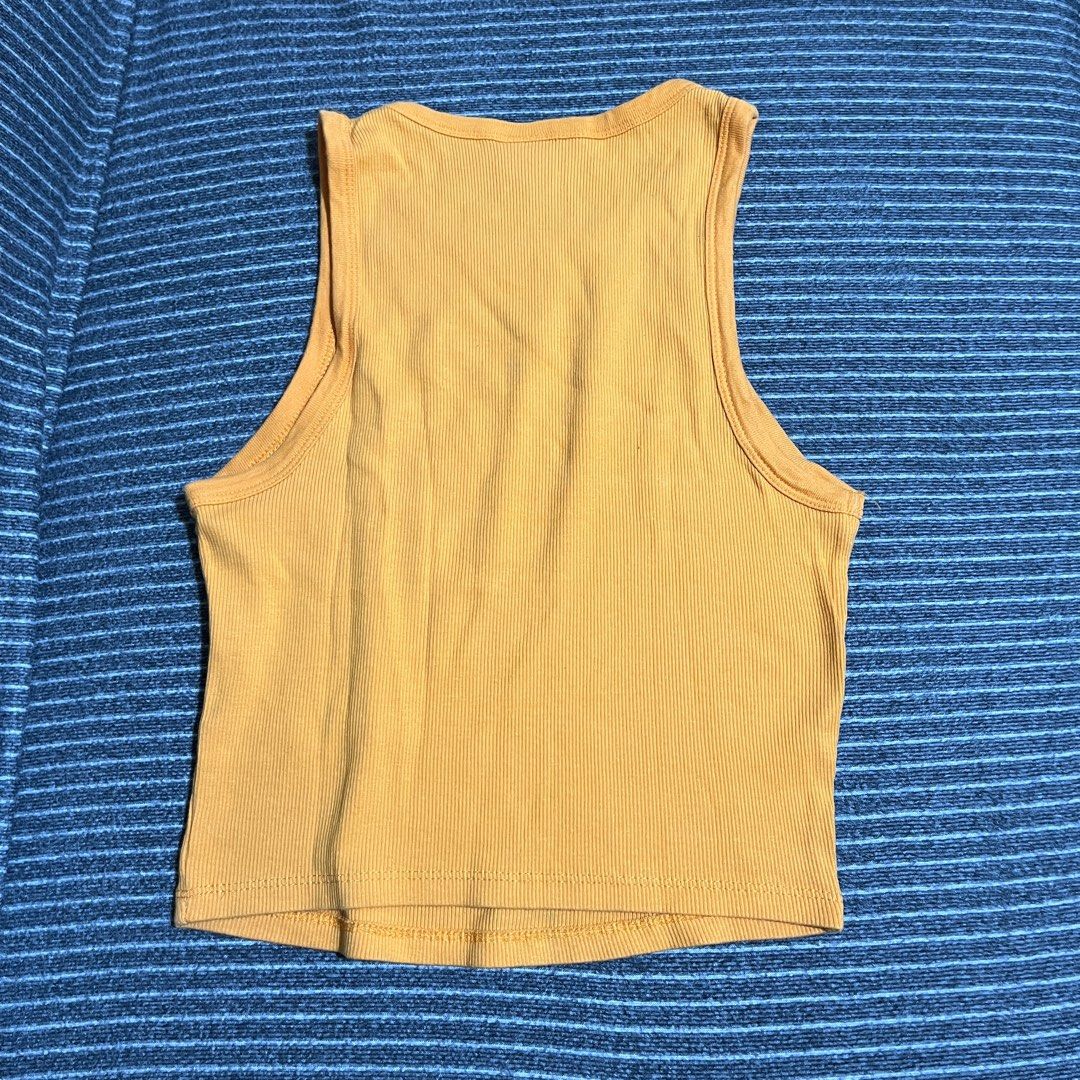 Bershka Ribbed Tank Top - Orange (Category: Sleeveless) located in Bacoor. Submitted by sunamr (Listing ID 1398801737, Image 3). Description: - Bershka mustard yellow ribbed tank top - Size: L - Cropped length - color is much brighter in person.