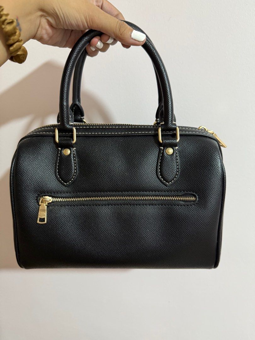 Coach Mini Satchel Bag / Coach Rowan (Category: Luxury Bags & Wallets) located in Manila. Submitted by zapglnwn (Listing ID 1398864410, Image 2). Description: - Black Coach mini satchel - Gold-tone hardware - Top zip closure - Dual top handles - Adjustable, detachable shoulder strap - Coach hang tag - Back zip pocket - Interior slip pocket - Contrasting white stitching not guaranteed authentic, bought in IG for ₱5,000 - used twice only.