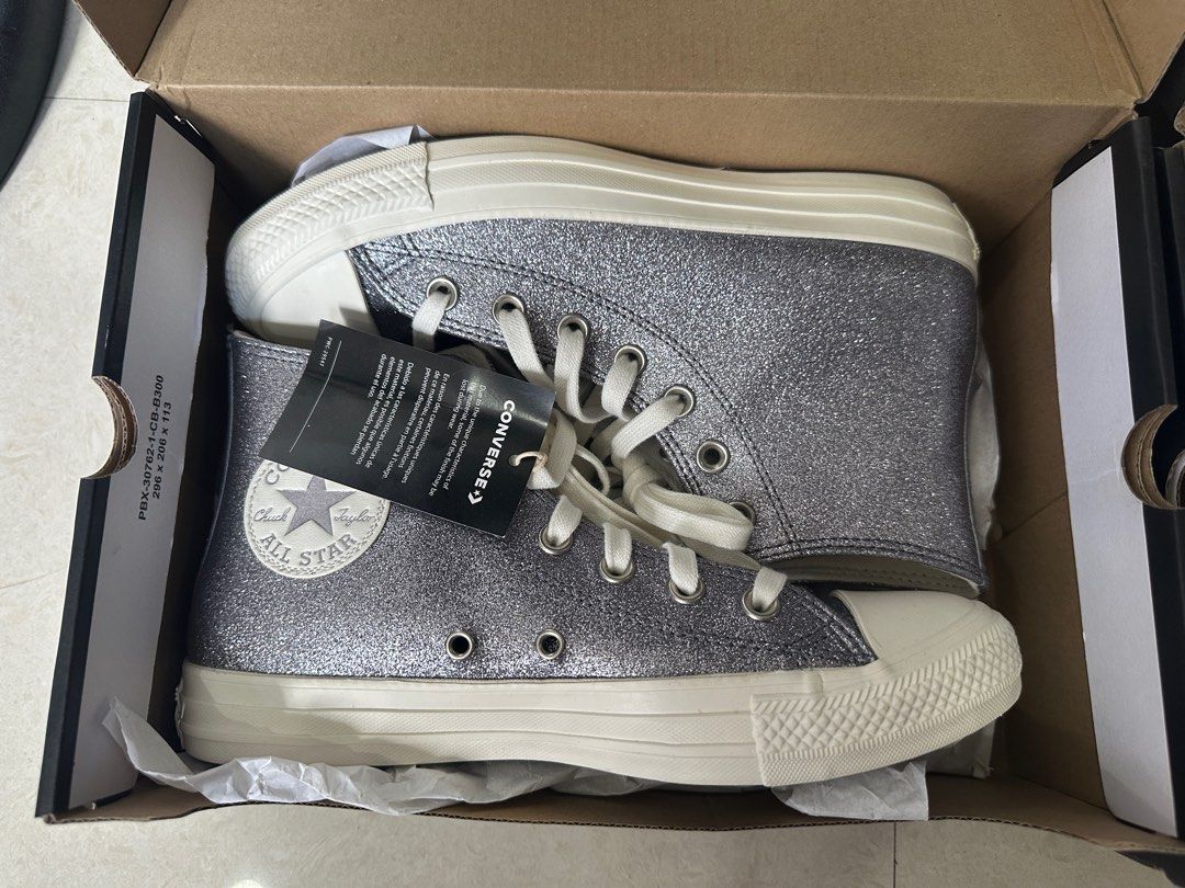 Converse Chuck Taylor All Star Glitter High-Top (Category: Sneakers) located in Mandaue City. Submitted by maeveywavy (Listing ID 1398741169, Image 1). Description: Original Brandnew Chuck Taylor All Star Glitter Size 8. Gunmetal/Silver glitter color. With box, tag, and planet sports paper bag With slight flaw. See pics. .