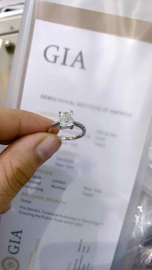 ENGAGEMENT EMERALD RING 💍 (Category: Rings) located in Manila. Submitted by szairajewel (Listing ID 1398820506, Image 2). Description: Elegant emerald cut diamond ring. Comes with a GIA certificate, ensuring authenticity and quality. The ring features a classic design with a sparkling diamond. A perfect piece for special occasions or everyday wear. The ring is set on a simple band, highlighting the brilliance of the diamond..
