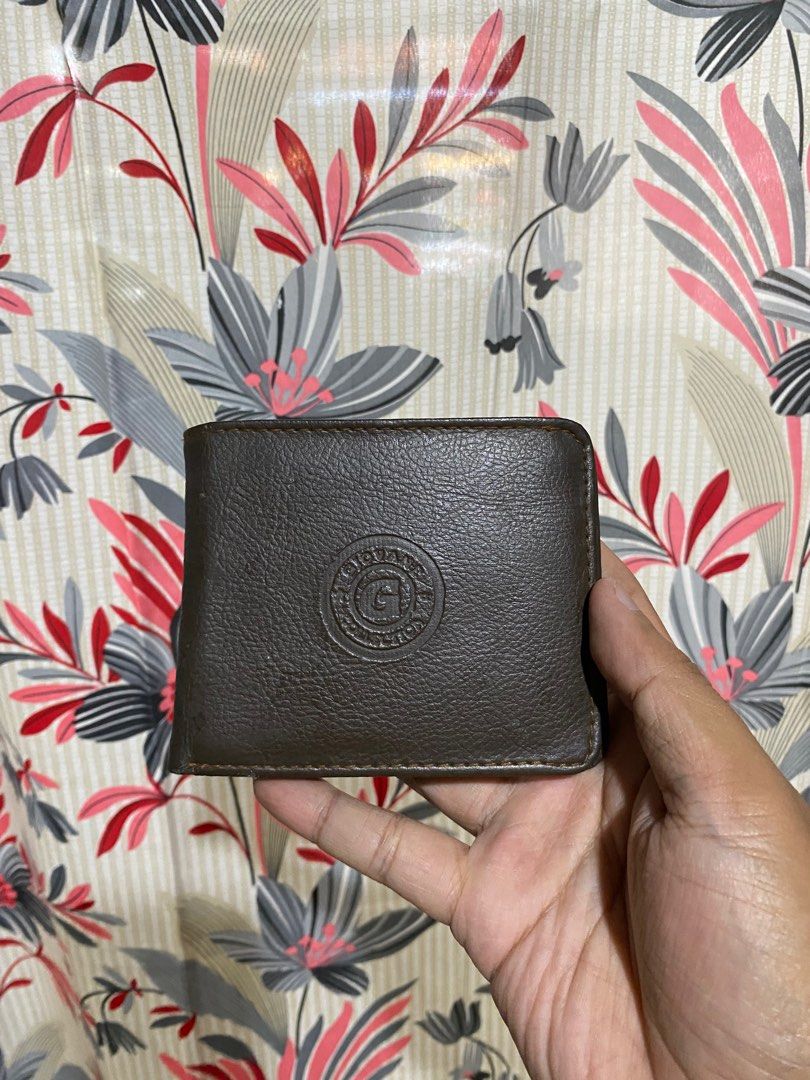 GENUINE LEATHER BI-FOLD WALLET WOMENS (Category: Wallets & Card holders) located in Lucena. Submitted by ojfinds (Listing ID 1398868885, Image 1). Description: ‼️FOR SALE‼️ GENUINE LEATHER BI-FOLD WALLET WOMENS Classic bi-fold design Multiple card slots Bill compartment Circular logo detail Condition : 8.5/10.