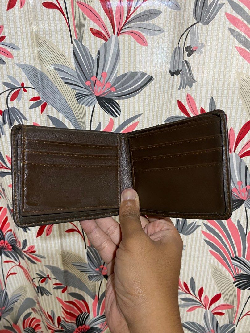 GENUINE LEATHER BI-FOLD WALLET WOMENS (Category: Wallets & Card holders) located in Lucena. Submitted by ojfinds (Listing ID 1398868885, Image 2). Description: ‼️FOR SALE‼️ GENUINE LEATHER BI-FOLD WALLET WOMENS Classic bi-fold design Multiple card slots Bill compartment Circular logo detail Condition : 8.5/10.