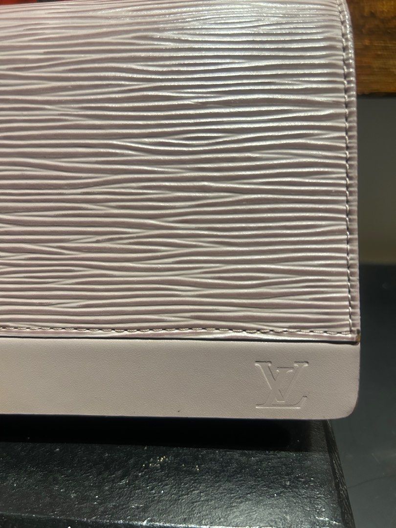 Louis Vuitton Epi Leather Chain Wallet (Category: Luxury Bags & Wallets) located in Mandaluyong City. Submitted by purselove (Listing ID 1398773320, Image 3). Description: - Authentic Louis Vuitton Epi Leather Chain Wallet - Color: Light purple/lilac - Material: Epi Leather with textured finish - Features: Flap closure, embossed LV logo - Interior: Multiple card slots and main compartment - Provided chain strap - Made in Spain .