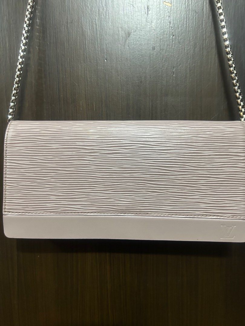 Louis Vuitton Epi Leather Chain Wallet (Category: Luxury Bags & Wallets) located in Mandaluyong City. Submitted by purselove (Listing ID 1398773320, Image 2). Description: - Authentic Louis Vuitton Epi Leather Chain Wallet - Color: Light purple/lilac - Material: Epi Leather with textured finish - Features: Flap closure, embossed LV logo - Interior: Multiple card slots and main compartment - Provided chain strap - Made in Spain .