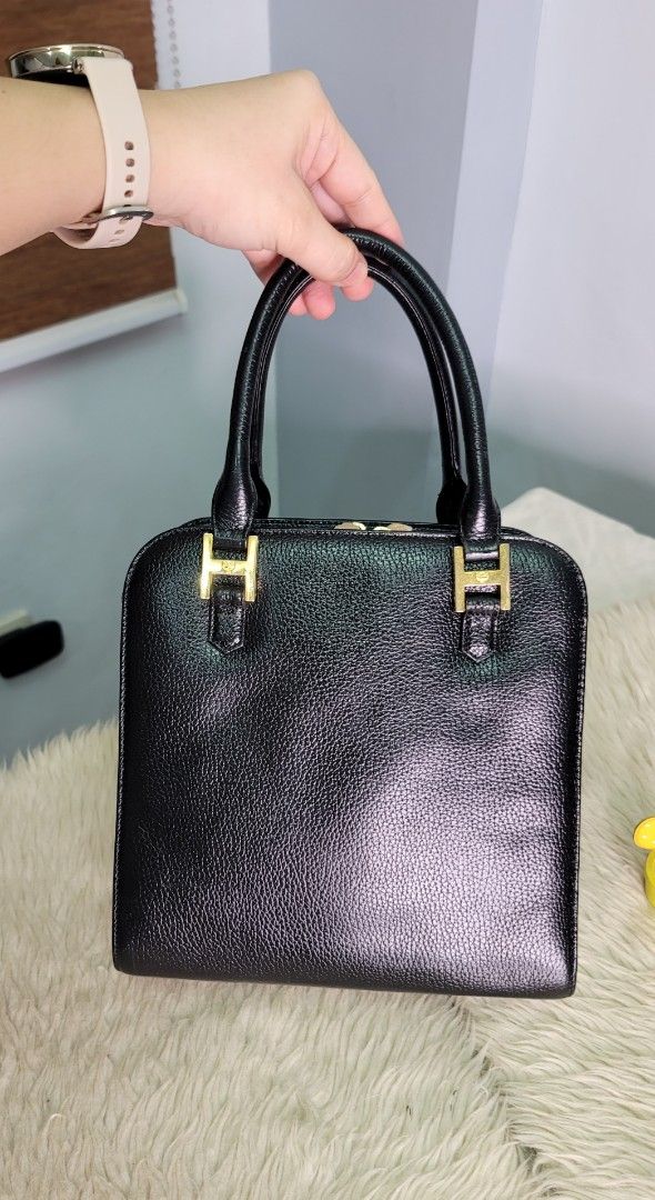 MCM Black Handbag (Category: Luxury Bags & Wallets) located in Cavite. Submitted by amairos (Listing ID 1398850998, Image 3). Description: - Black MCM handbag - Gold-tone hardware - Top handle - Zip closure - Interior pocket - MCM logo lining - Structured design - Textured exterior - Gold MCM logo on front semi medium .